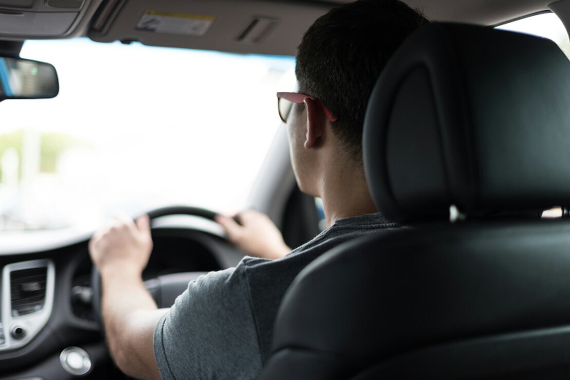 Driving instructor giving supportive feedback to a learner driver